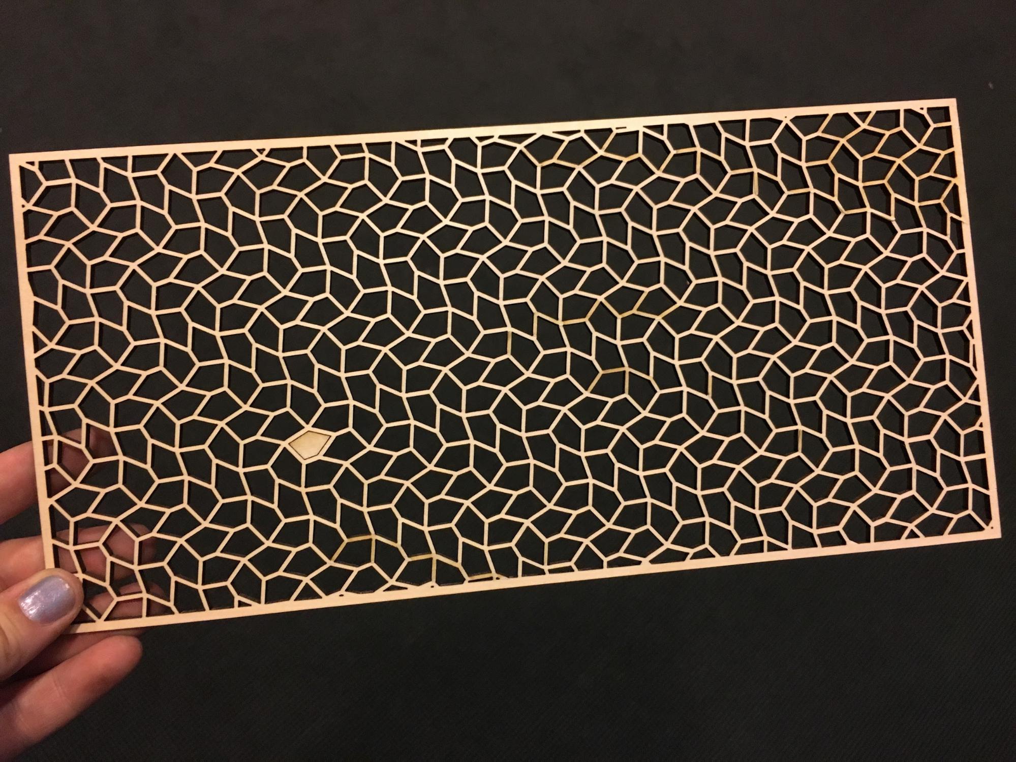 Laser cut open-tile design of a Type 9 pentagonal tessellation